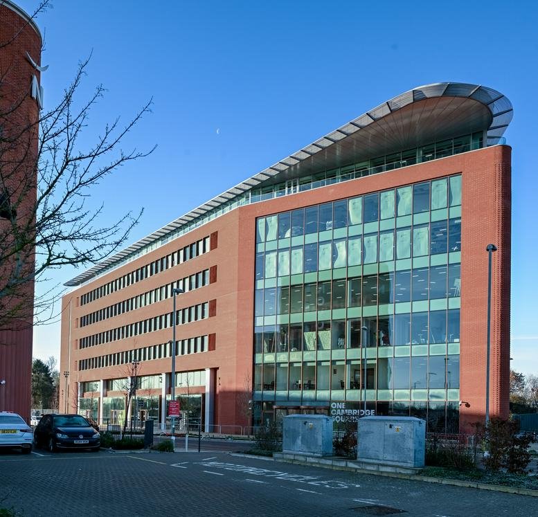 Exterior view of the modern red-brick facade at 1, Cambridge Square.