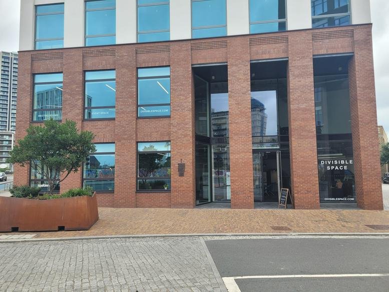 Brick and glass exterior of DivisibleSpace, 1 Sugar House Lane, Stratford, London.