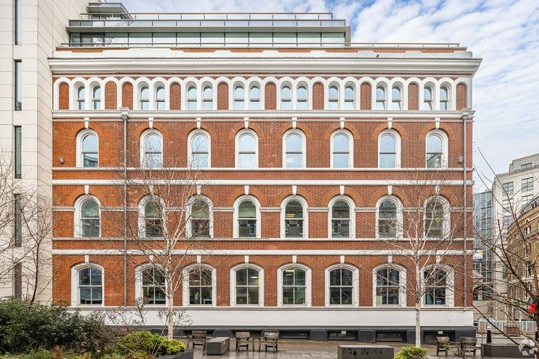 Street-level view of the historic red brick facade at 10, Saint Bride Street, London.