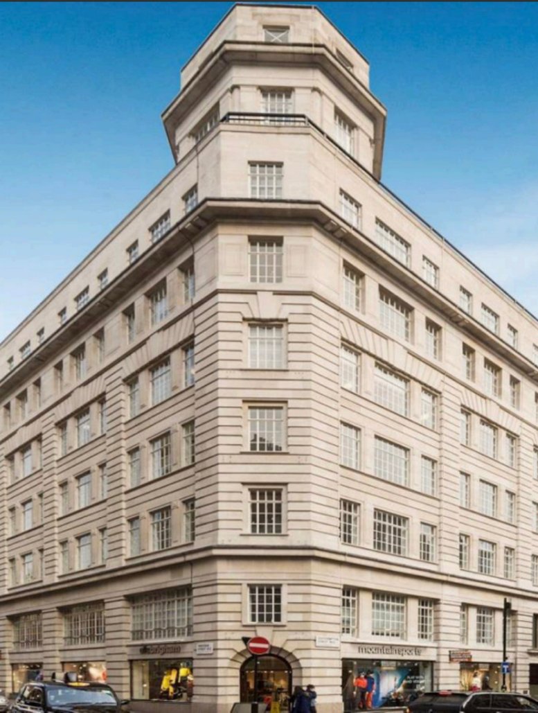 Grand stone exterior view of 10, Southampton Street, London featuring a distinctive octagonal corner tower.