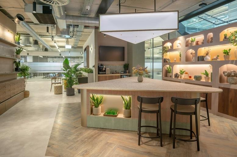 A stylish wooden kitchen and breakout area at 100 Barbirolli Square, Level 00 and 01, Manchester.