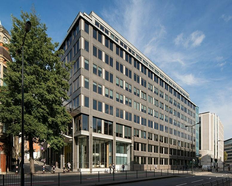 Exterior view of the modern grey facade at 100 Lower Thames Street in London.