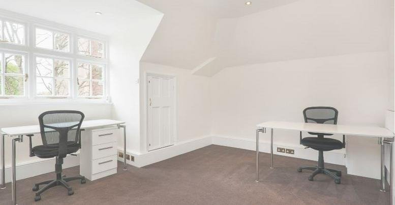 Spacious two-person office suite at 105 Sumatra road with white desks and natural light from a bay window.