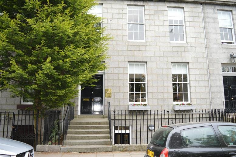 Exterior view of the granite stone facade and entrance at 11 Bon Accord Crescent.