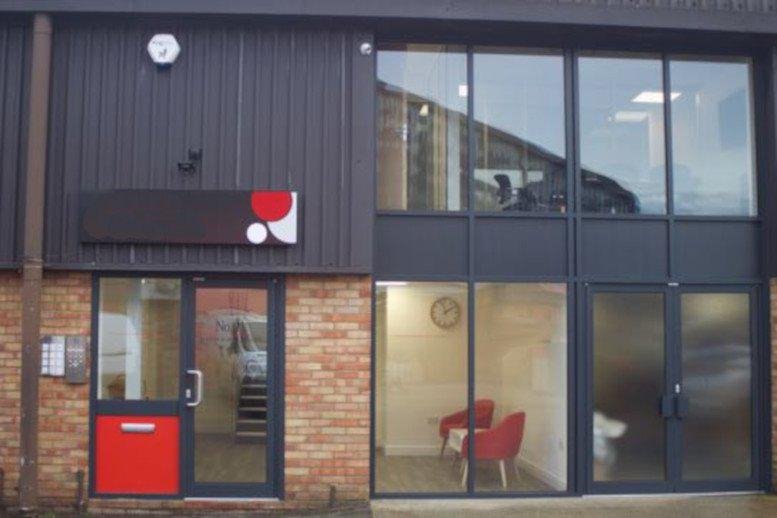 Exterior view of the modern brick and metal facade at 11 Riverside Park Industrial Estate.