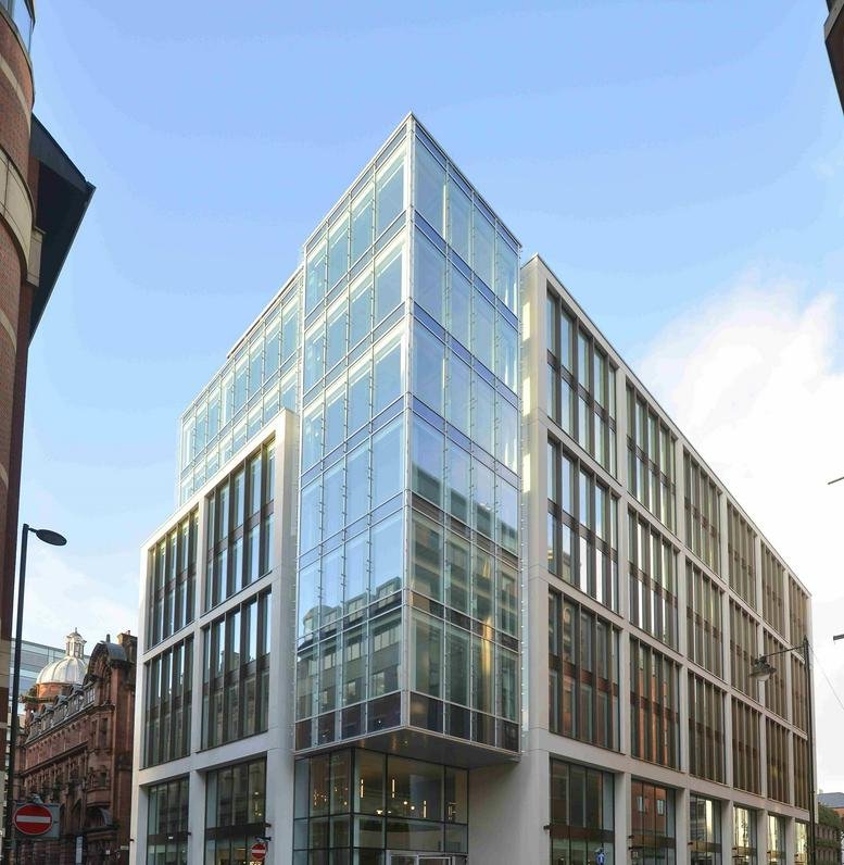 Exterior view of the modern glass and stone facade at 11 York Street.