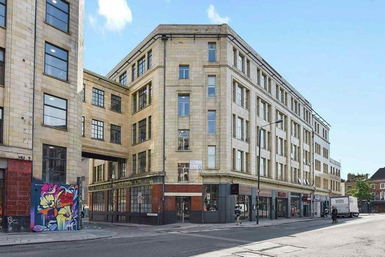 Exterior view of the traditional stone-fronted building at 116, Commercial Street, London.