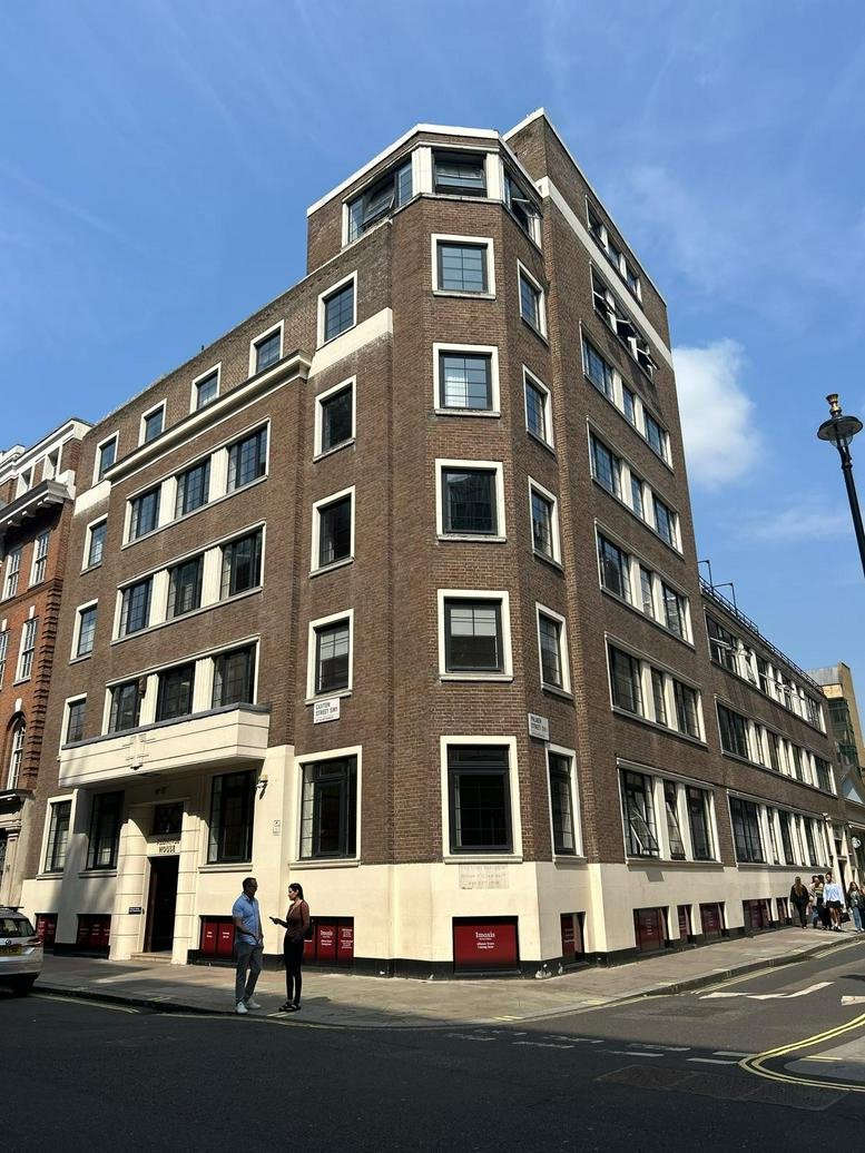 Exterior view of the brick facade and corner entrance at 12 Caxton Street.