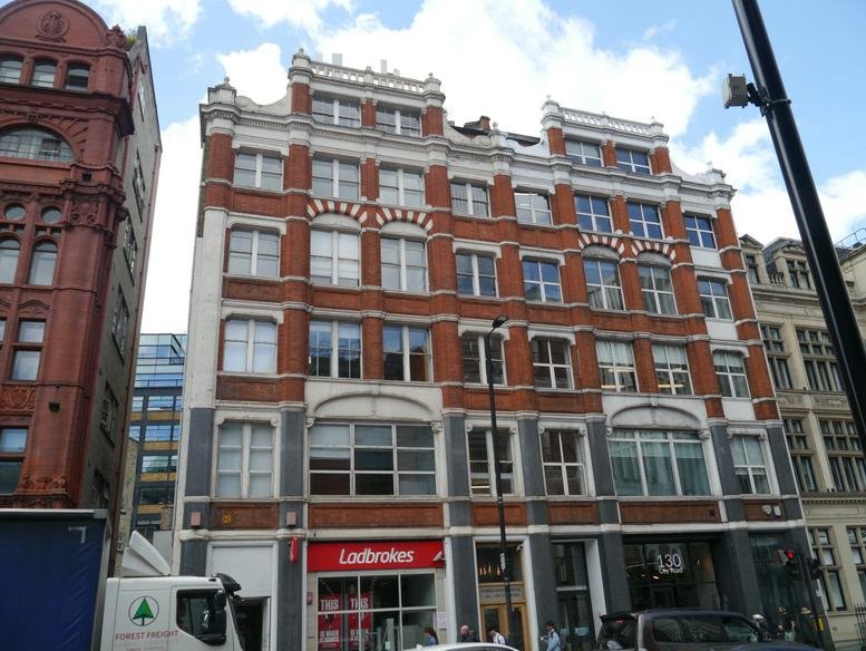 Exterior view of the historic red brick and white stone facade at 124-128 City Road.
