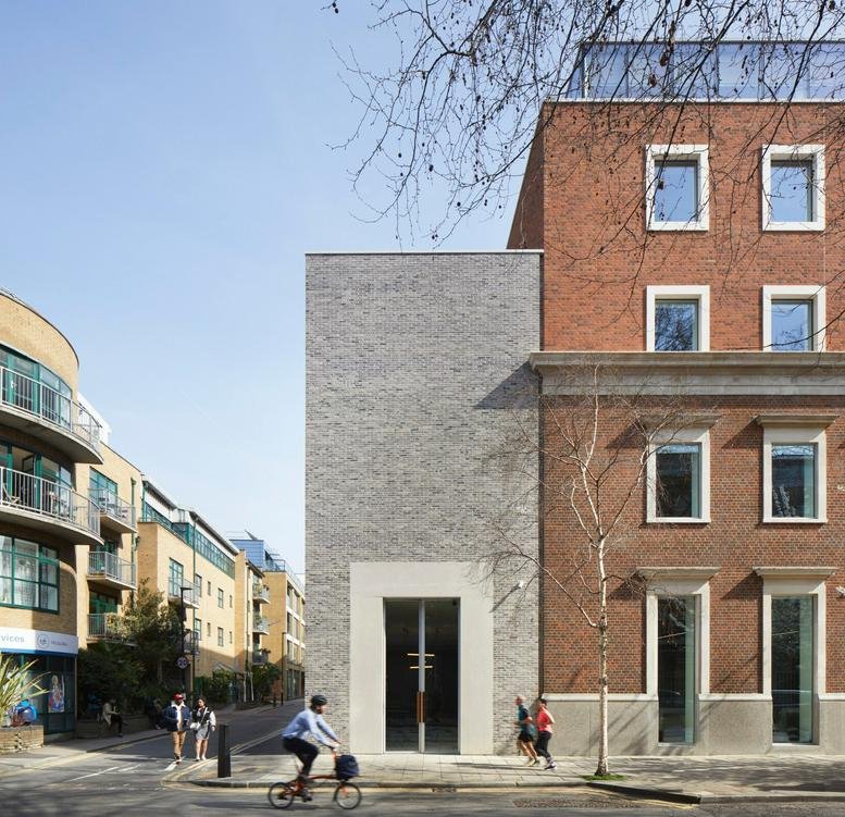 Exterior view of the modern brick and stone facade of 132-140 Goswell Rd.