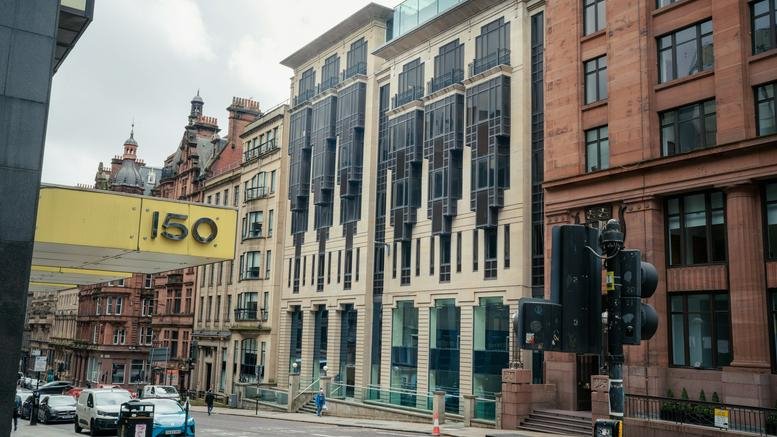Exterior view of the ornate stone and glass facade of 139 Saint Vincent Street, Glasgow.