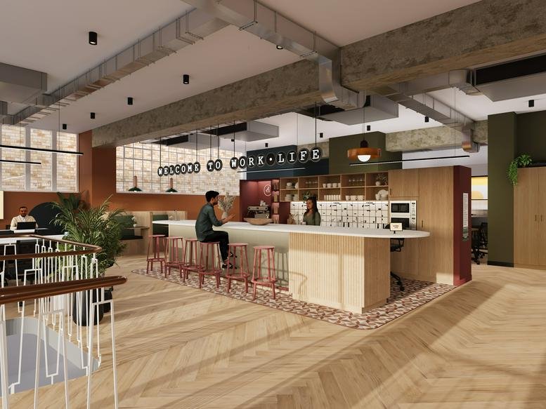 Spacious coworking cafe area at 140 Borough High Street with a wooden bar and industrial ceilings.