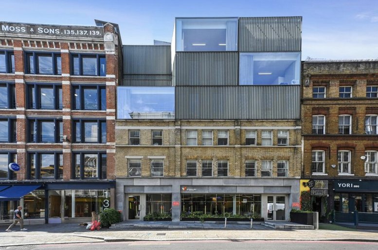 Exterior view of the historic brick and modern glass facade at 141, Curtain Road, London.
