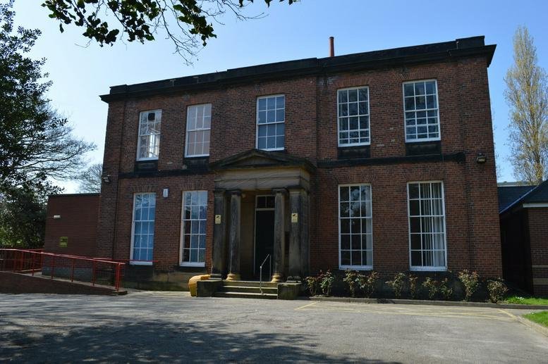 Exterior view of the red brick period building at 15, Margaret Street, Wakefield.