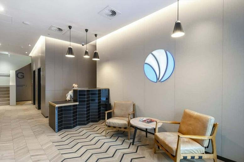Welcoming reception at 155, Fenchurch Street, City of London with soft lighting and a chevron patterned rug.