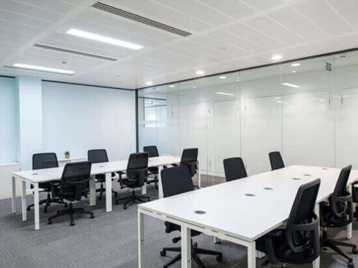 Spacious open-plan office suite at 16-20 Causeway with white desks and glass partitions.