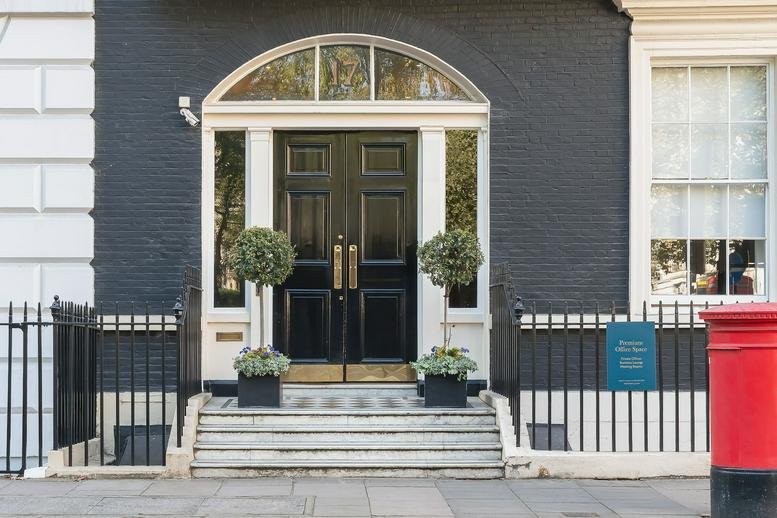 Exterior view of the black brick facade and arched entrance at 17 Cavendish Square.