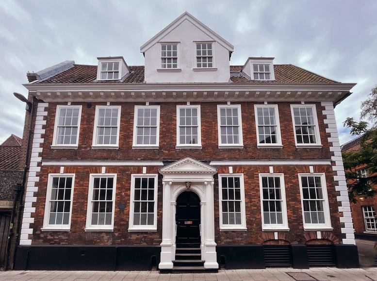 Exterior view of the historic brick facade at 18 Colegate, Norwich, Norfolk.