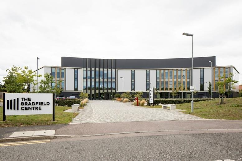 Exterior facade of The Bradfield Centre with modern architecture and landscaped entrance.