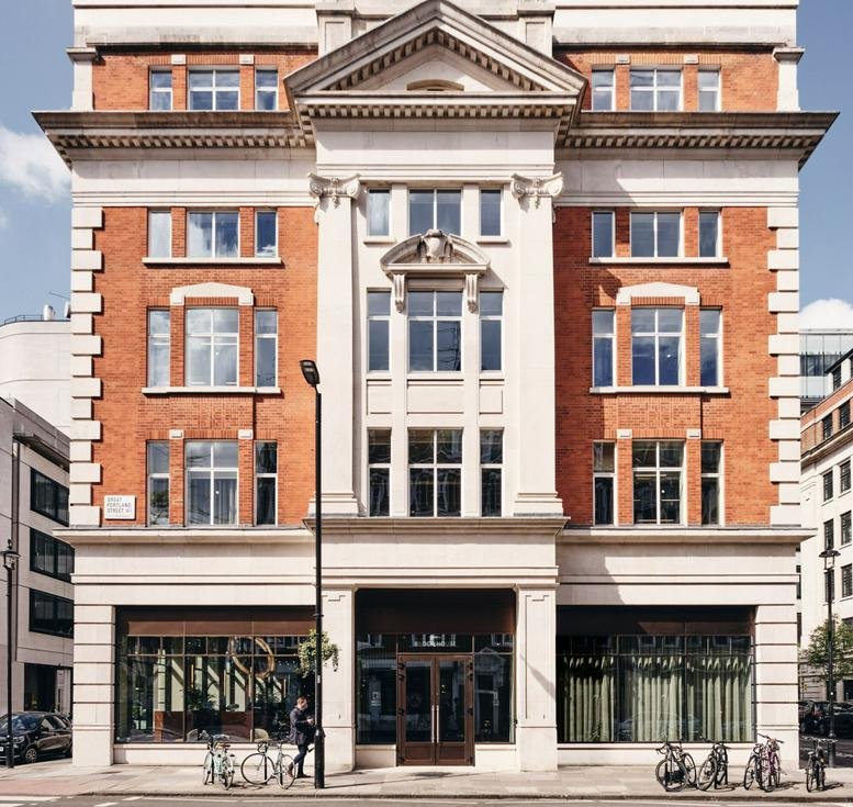 Exterior view of the red brick and stone facade of Brock House at 19 Langham Street.