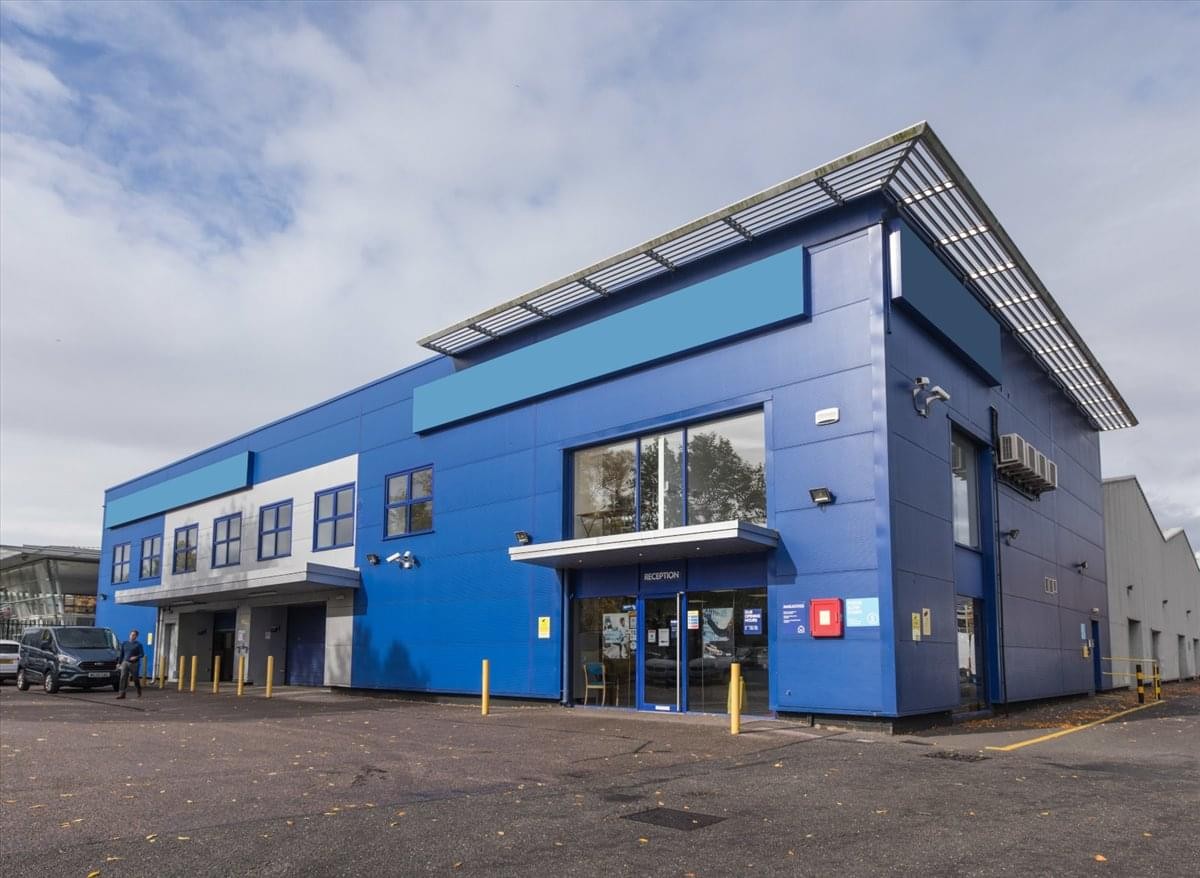Exterior view of the blue-clad commercial building at 19 Moorfield Road, Slyfield Industrial Estate.