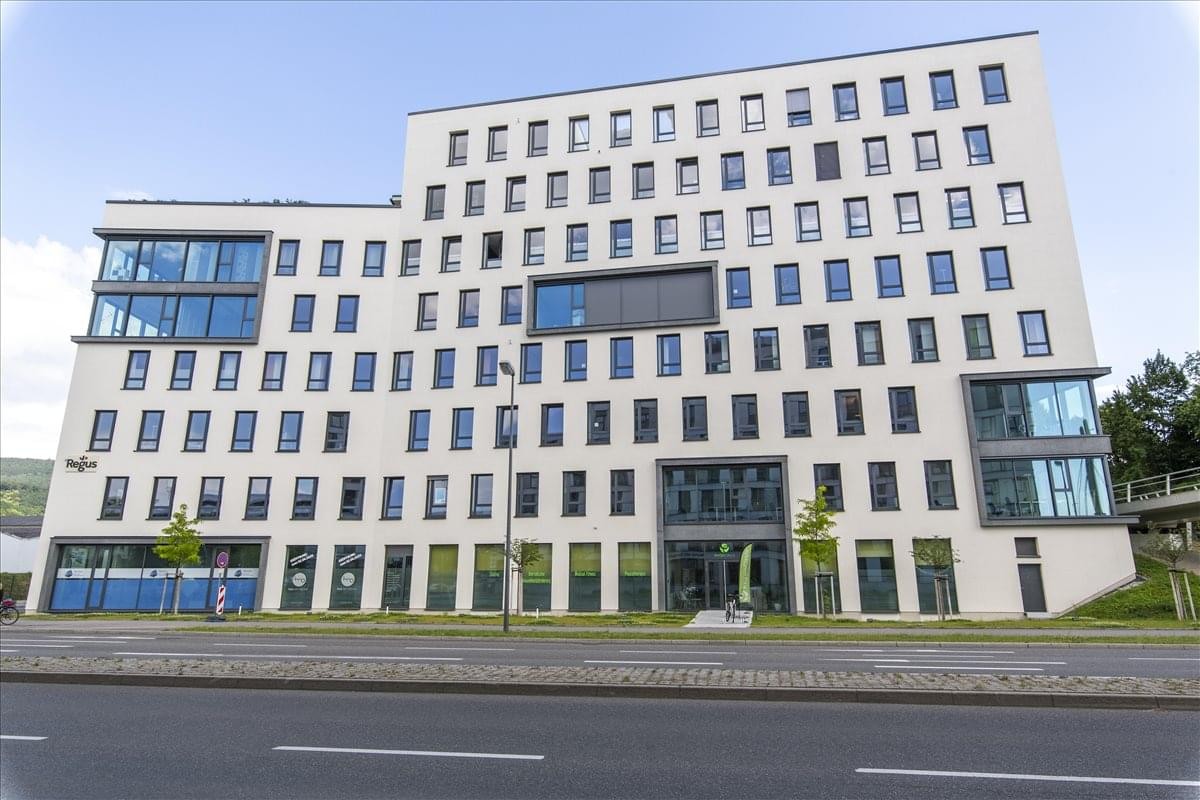 Exterior view of the modern white office building at Rudolf-Diesel-Str. 11.