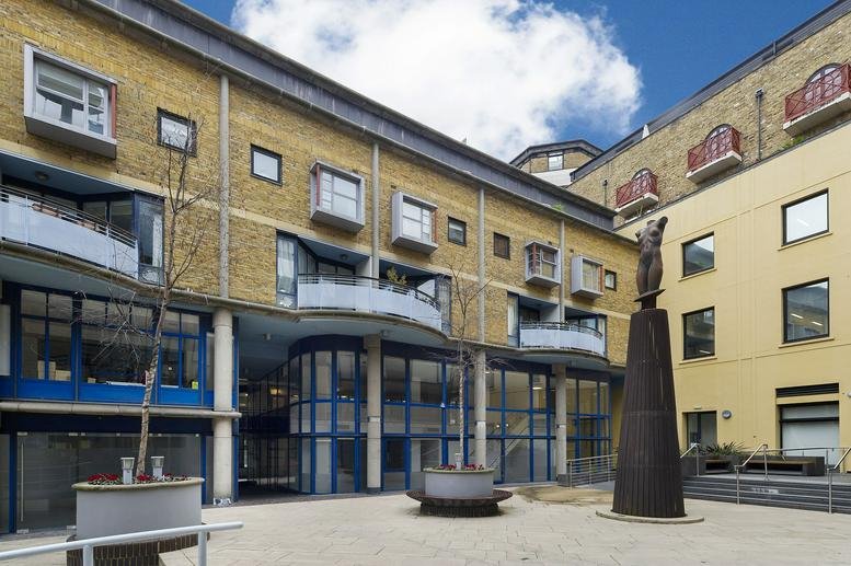 Exterior view of the brick facade and courtyard at 2-7 Brewery Square, Knot House.
