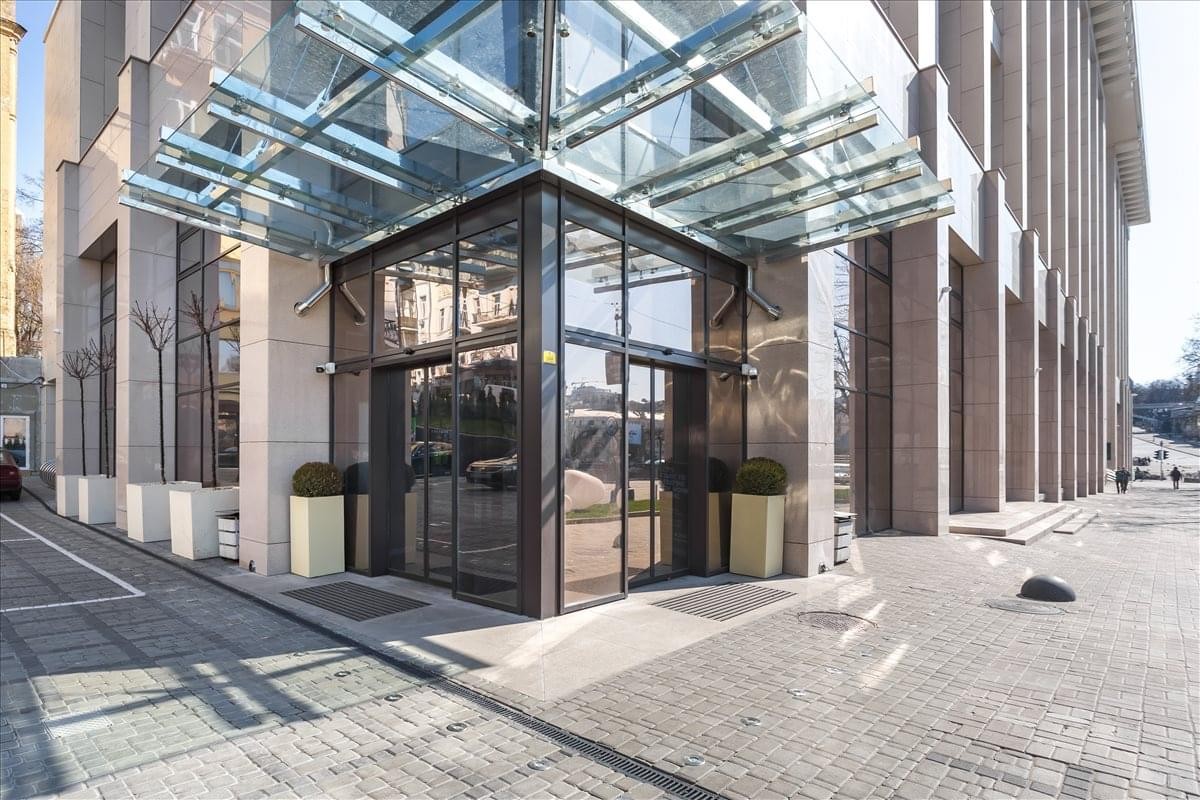 Exterior view of the glass entrance and modern facade at 2 Maidan Nezalezhnosty sq, Kiev.