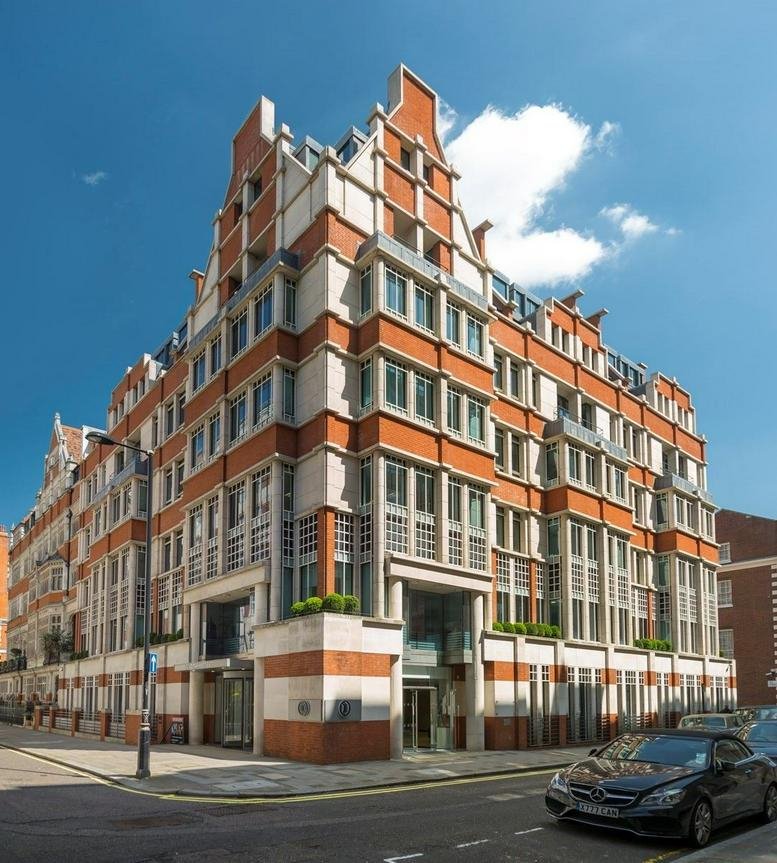 Exterior view of the red brick and stone facade of 2 Park Street, Central London, W1K.