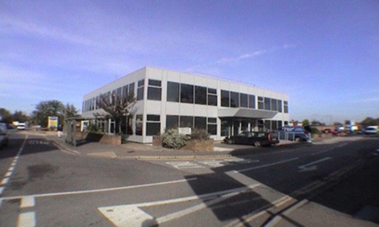 Exterior view of the white facade office building at 201-203 London Road, East Grinstead.