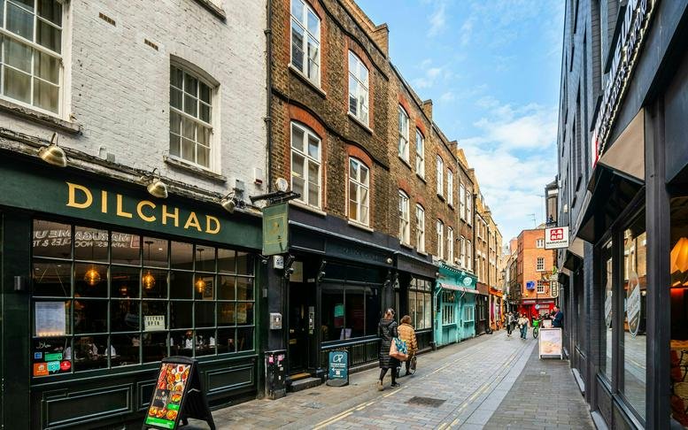 Exterior view of the traditional brick building at 22-23 Widegate Street in the City of London.