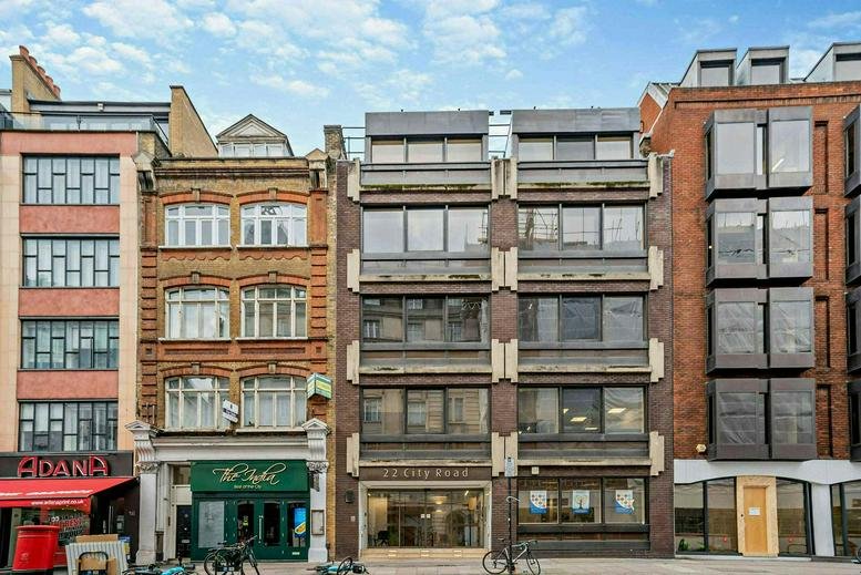 Exterior view of the historic brick and modern stone facade at 22 City Road.
