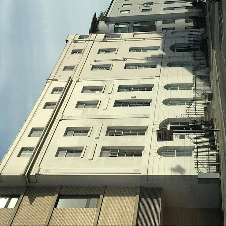 Exterior view of the multi-story white building at 22 Compass Point, Ensign Way.