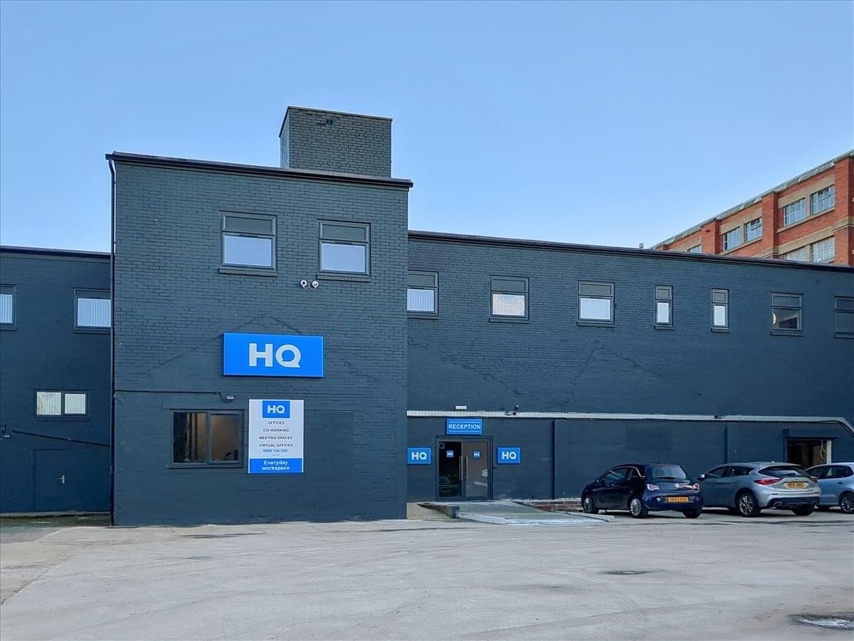 Dark grey exterior facade of the headquarters building at 225 Denby Dale Road.