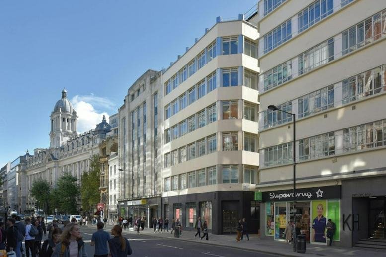 Exterior view of the classic stone and modern glass facade at 233, High Holborn, London.