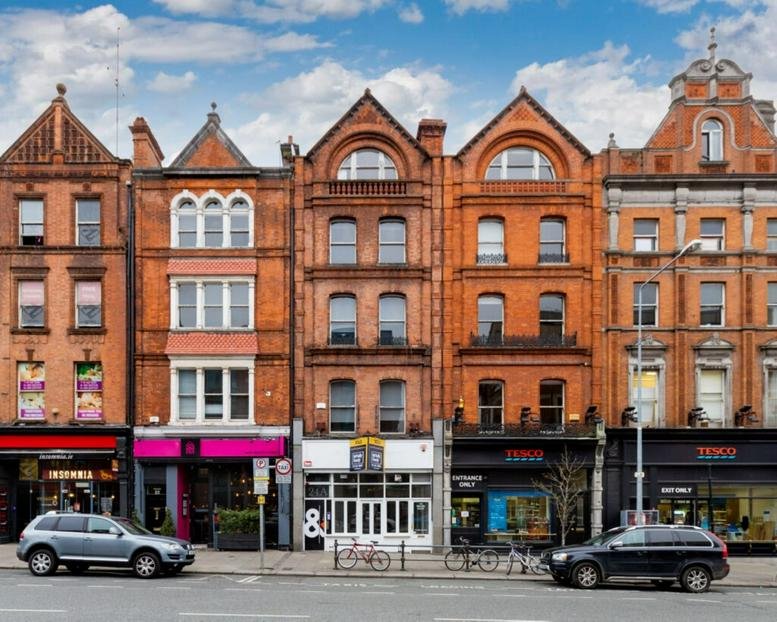 Exterior view of the traditional red brick buildings at 24 Baggot Street Upper.
