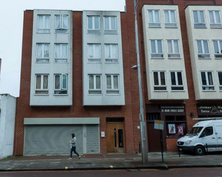 Exterior view of the brick facade building at 244a Kilburn High Road.
