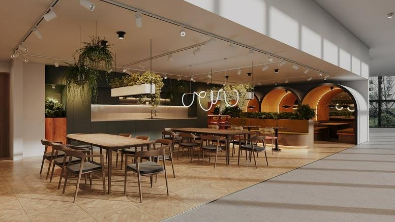 Spacious communal lounge and dining area at 269 Great Ancoats Street with booth seating and plants.