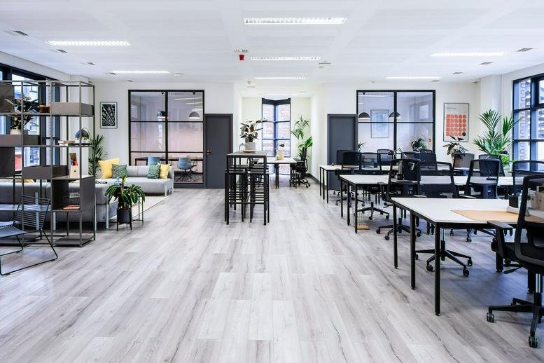 Spacious open-plan workspace at 28 Brunswick Place, Old Street, London with wooden floors and plants.