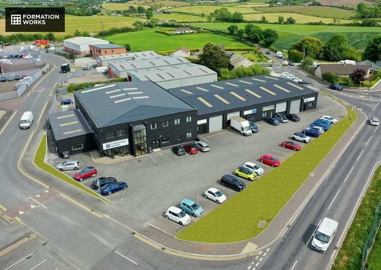 Aerial exterior view of the black modern building at Maryland Industrial Estate.