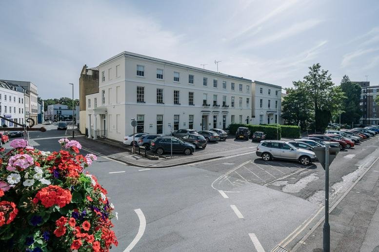 Exterior view of the white regency-style building at 29 Cambray Place, Cheltenham.