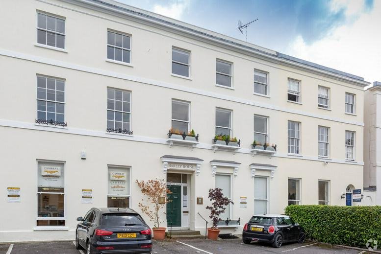 Exterior view of the white Georgian facade of 29 Cambray Place, Cheltenham.