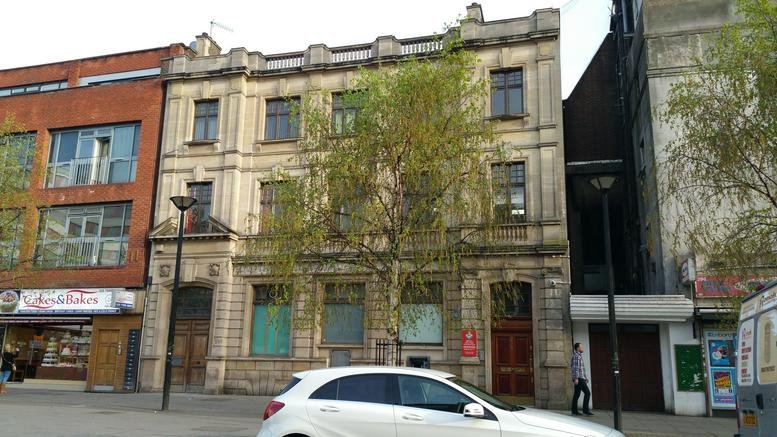 Exterior view of the stone-facade building at 298 Romford Road.