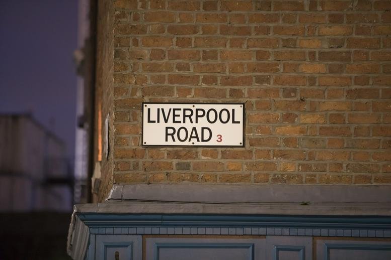 Street sign for 29a Liverpool Road, Castlefield, Manchester on a brick wall.