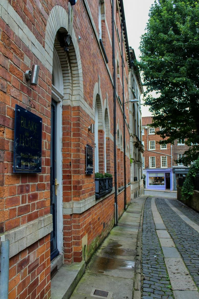 Exterior view of the red brick building facade at 2A St Martins Lane, York.