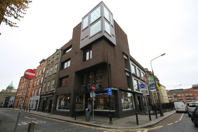 Exterior view of the dark brick building facade at 3 Castle Street, Dublin 2.