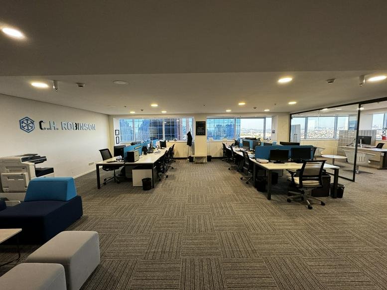 Large open-plan workspace at 3, Maslak Meydan Sokak with desks and city views.