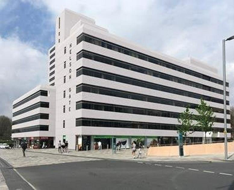 Exterior view of the white facade of Nelson Gate at 3 Newbridge Square.