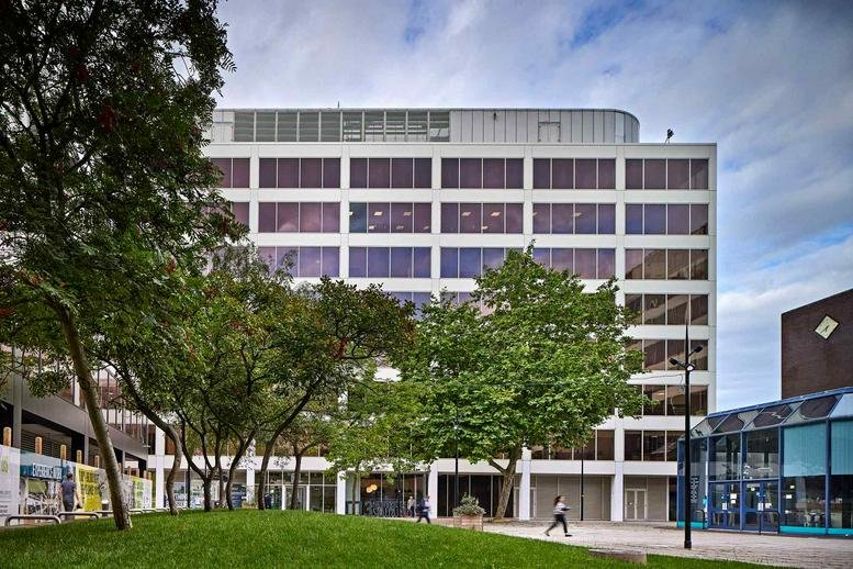 Exterior view of the white multi-story professional building at 3 Newbridge Square.