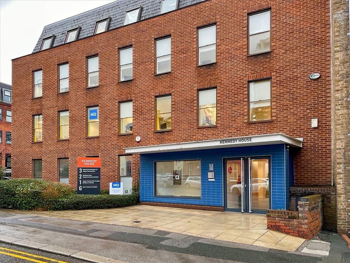Exterior red brick facade of Kennedy House with a modern blue ground floor entrance.